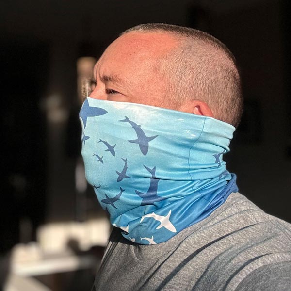 Neck gaiter featuring sharks