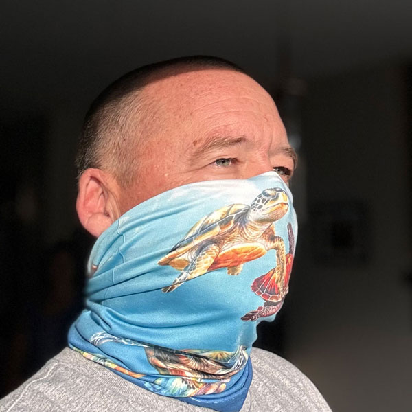 Neck gaiter featuring turtles