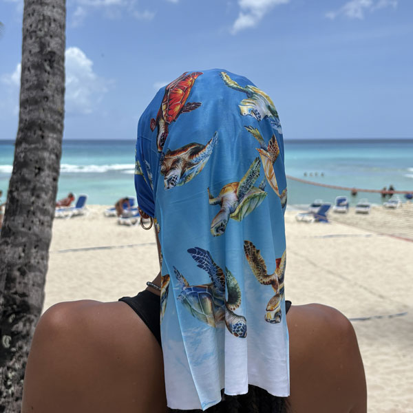 Blue neck gaiter featuring turtles